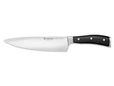WÜSTHOF Classic IKON 8-Inch Chef's Knife blade close-up showing precision-forged steel for clean cuts.