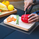 Xfenvs non-slip cutting board mat top view keeps boards steady for safe chopping.