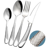 Xideman hammered knife close-up highlights the ultra-sharp serrated edge for easy slicing.