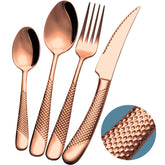 Xideman modern copper hammered silverware set on table for stylish dining.