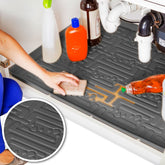Xtreme Mats waterproof undersink mat in gray protects kitchen cabinets from leaks.