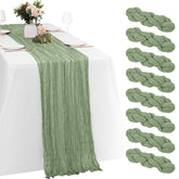 Yorcari sage green cheesecloth table runner with natural wrinkles for elegant table styling.