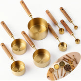 Yuzi golden measuring cups with wooden handles for precise kitchen measurements.