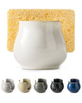 Zoeeker ceramic sponge holder on the sink countertop keeps sponges neatly organized.