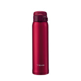 Zojirushi Garnet Red stainless mug front view showcasing compact carry design.