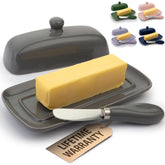 Zulay Butter Dish with Lid in porcelain white on countertop for convenient spreading.