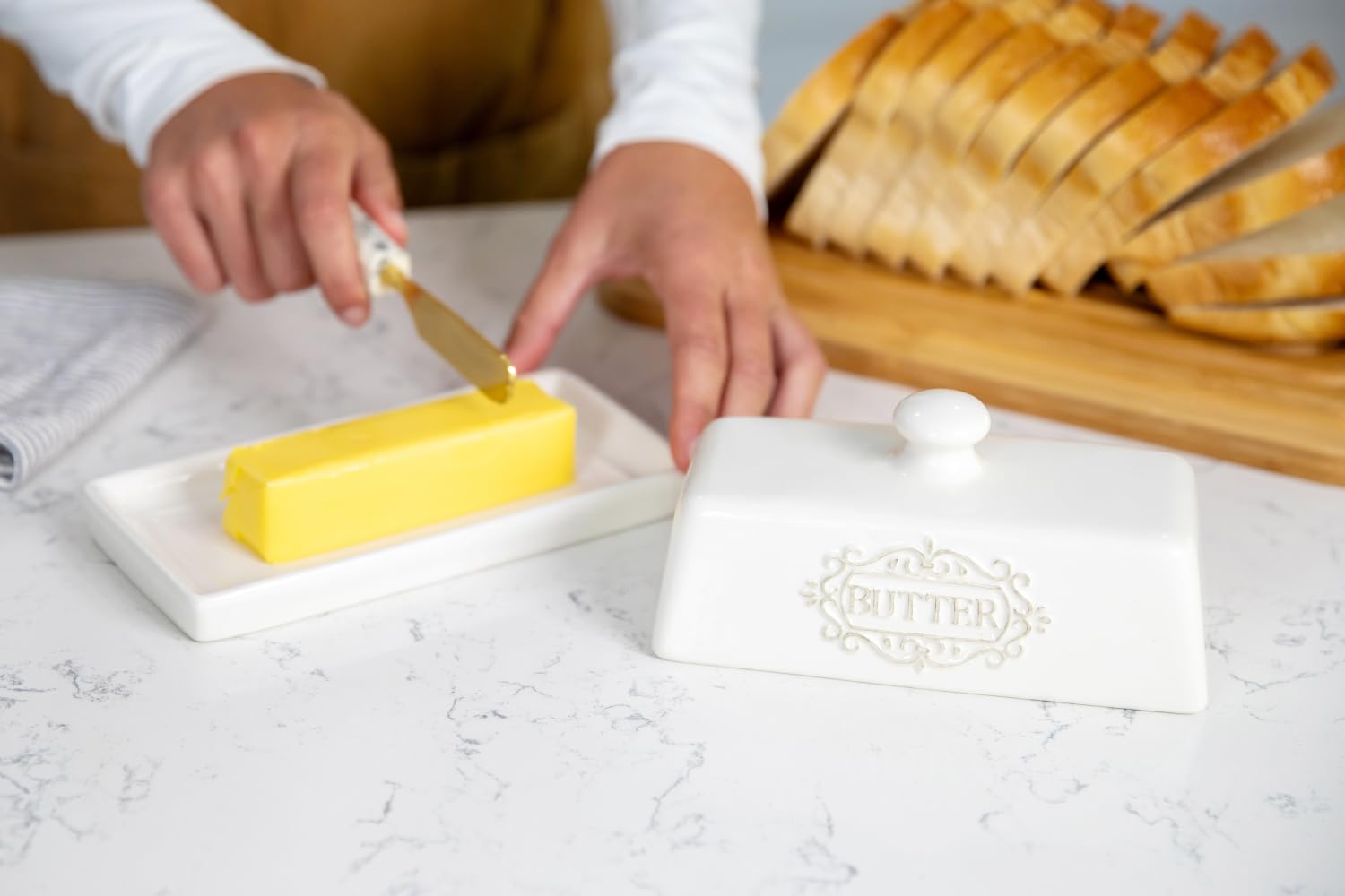 25DOL white butter dish adds a touch of table art to kitchen counters.