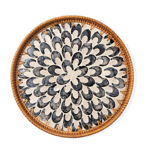 Aayoruro round rattan tray with mother of pearl inlay for an elegant dining display.