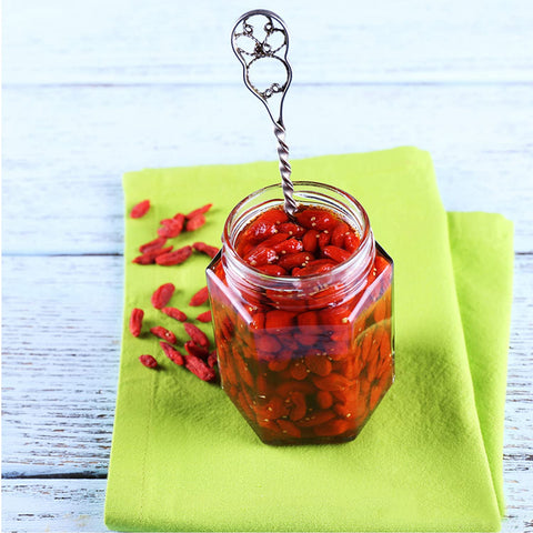 Accguan jar filled with jam demonstrates versatile kitchen storage.