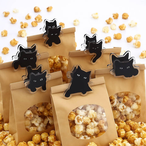 Acellegic cat-shaped magnet clip sticks lightly to metal surfaces.