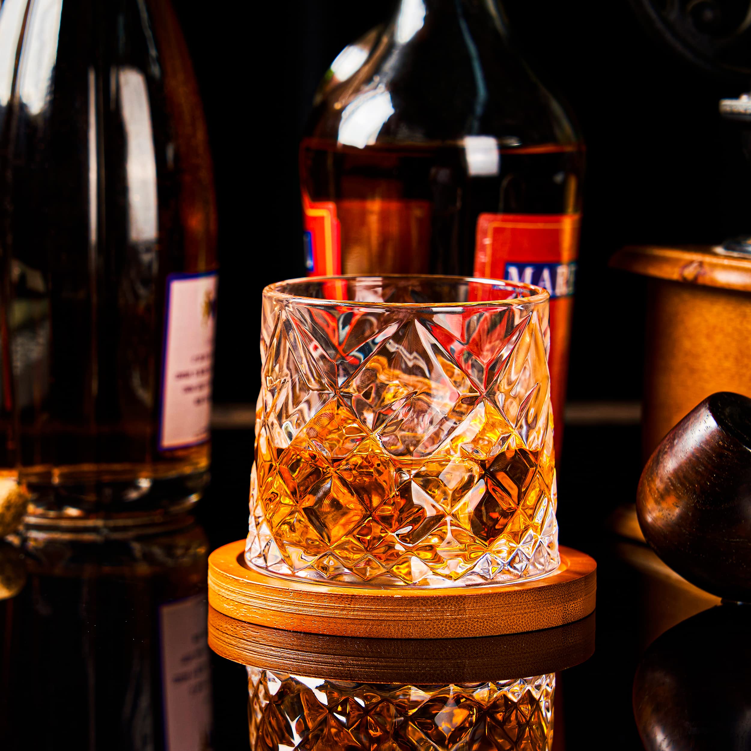 ACHEER crystal whiskey glass under lights showing luxury luster.