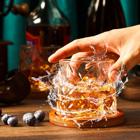 ACHEER turning whiskey glass demonstrates meditative rotation for a calm moment.