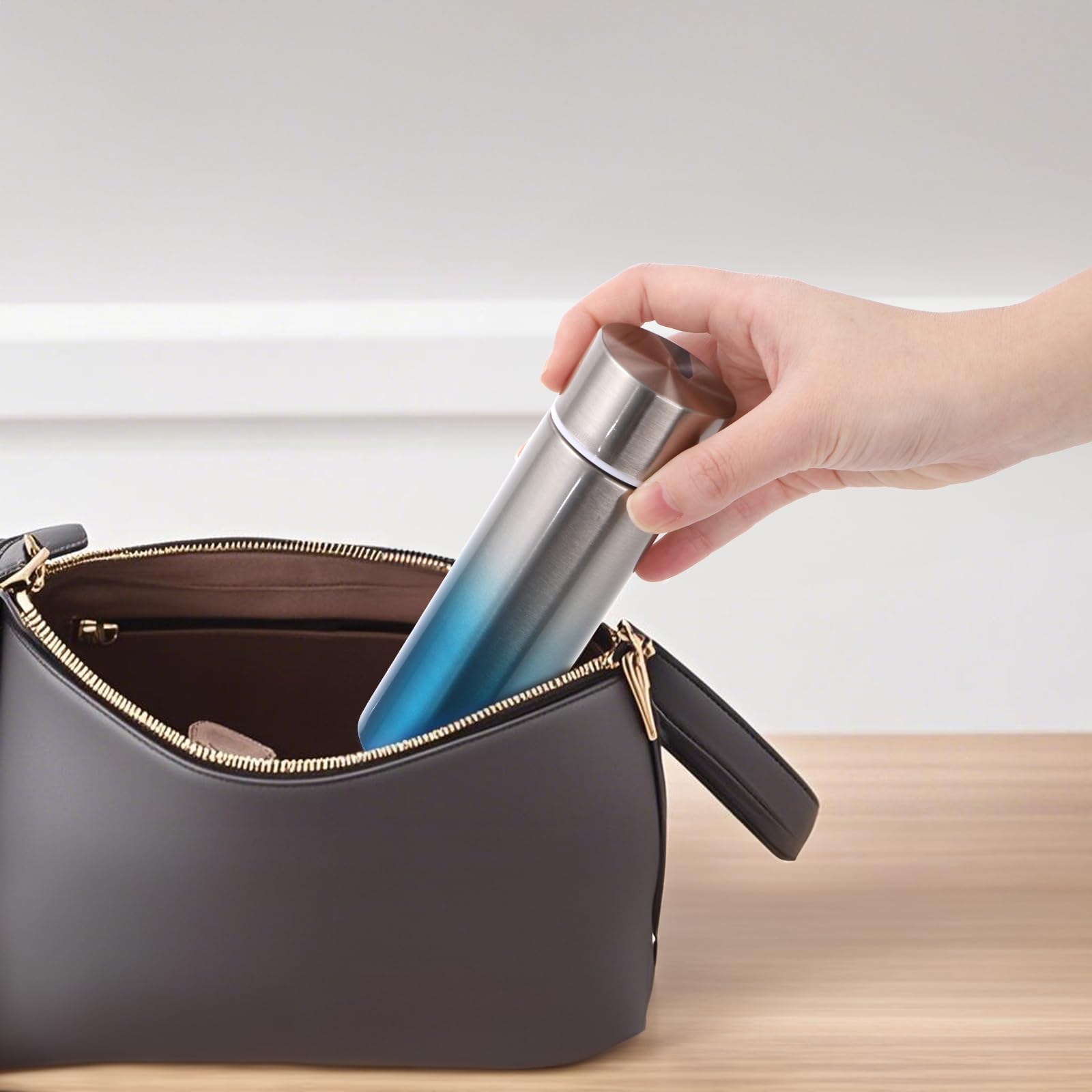 Acshio purse-friendly bottle fits inside a handbag for quick hydration