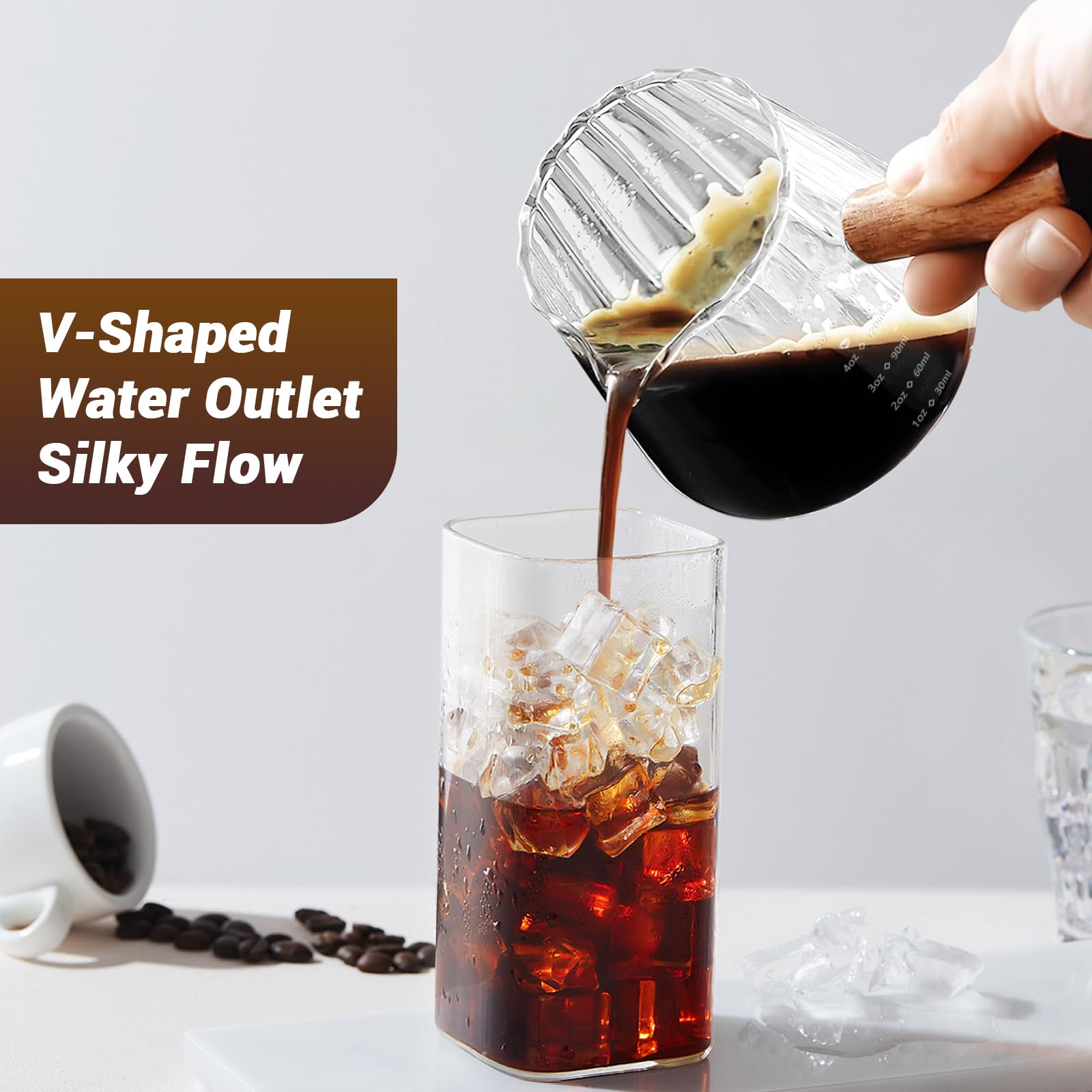 Aecsze versatile glass measuring cup for steaming milk and measuring ingredients.
