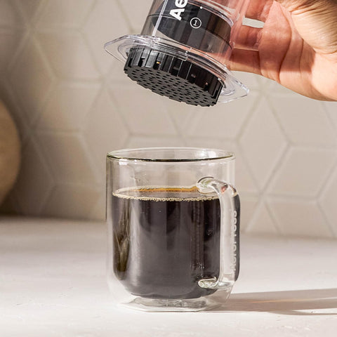 AeroPress brew close-up using micro-filter for smooth cup