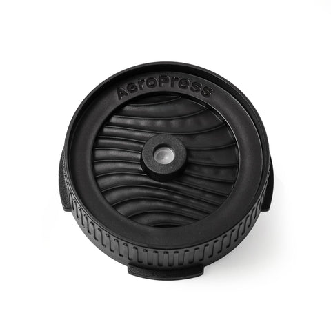AeroPress Flow Filter Cap pour-control shows drip-free brewing for precise grind-size adjustments.