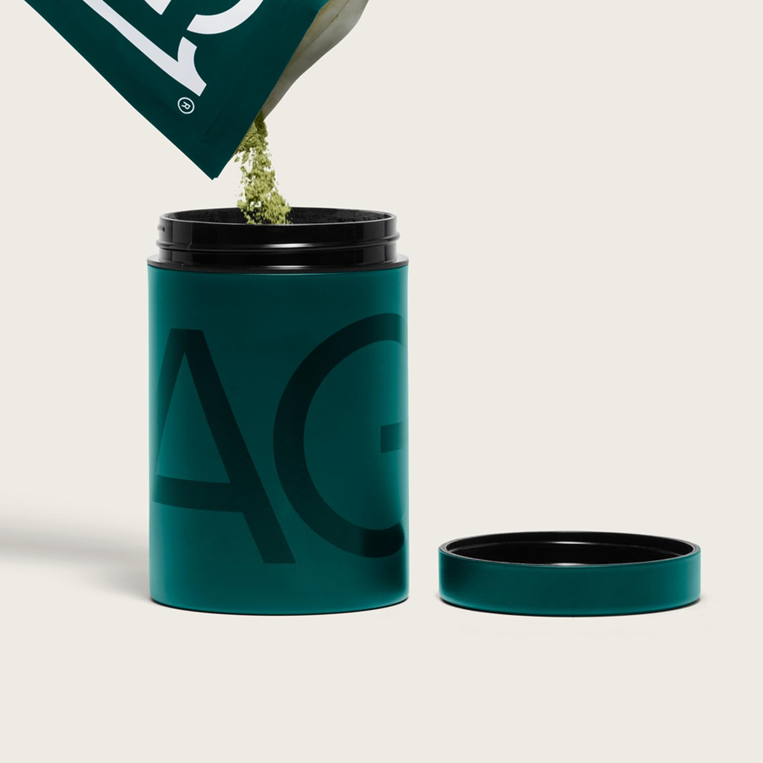 AG1 stainless steel BPA-free canister featuring an airtight seal to preserve freshness.