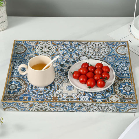 AGIOTA serving tray with handles placed on a sofa for easy transport
