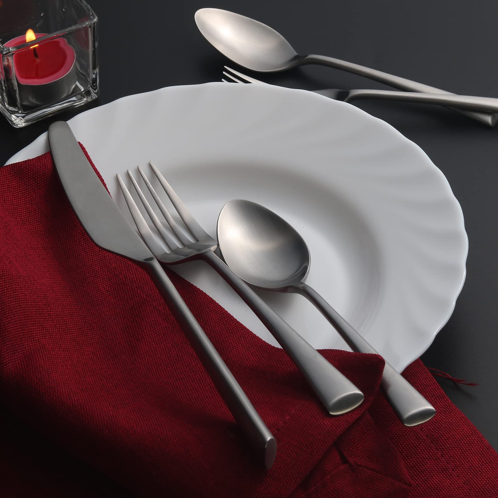 Family dining scene featuring Alata Bailey flatware during casual dinner