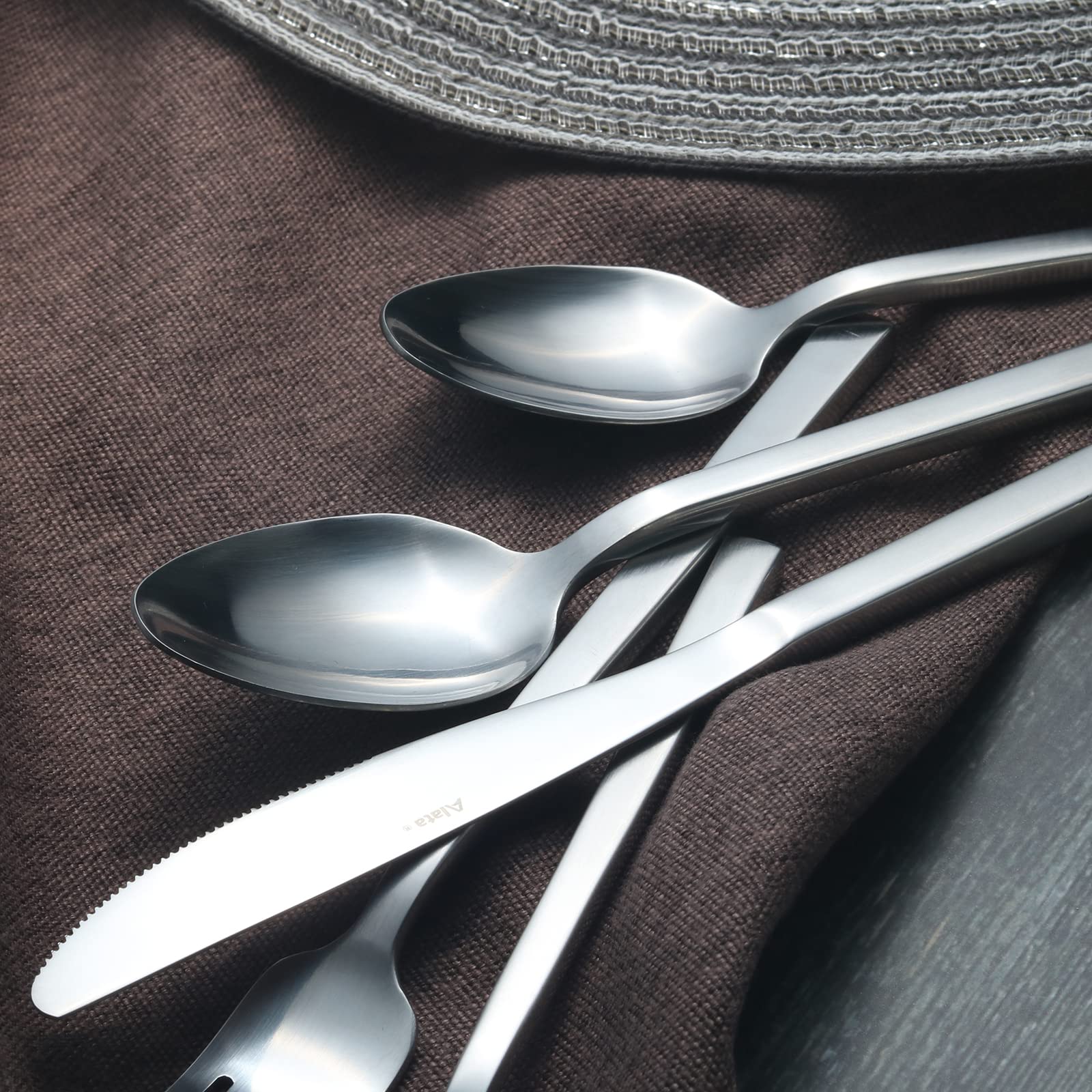 Alata Cube dinner spoon with smooth surface, easy to clean after meals.