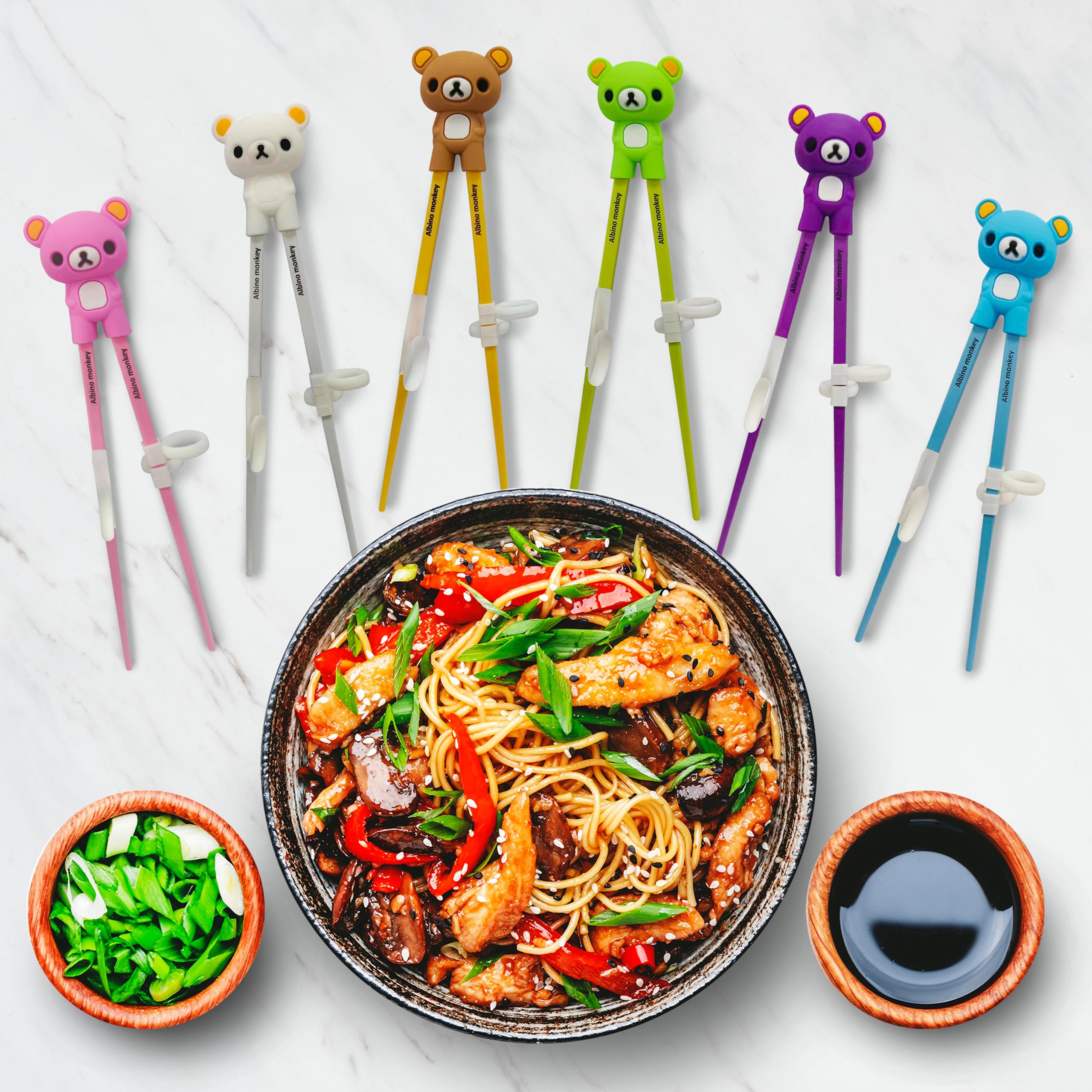 Albino Monkey easy-grip chopsticks support confident toddler handling.