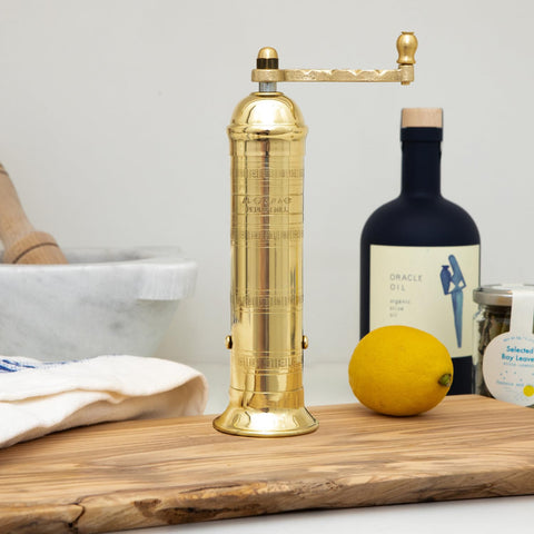 Alexander Home brass pepper mill close-up on grinding mechanism for richer aroma