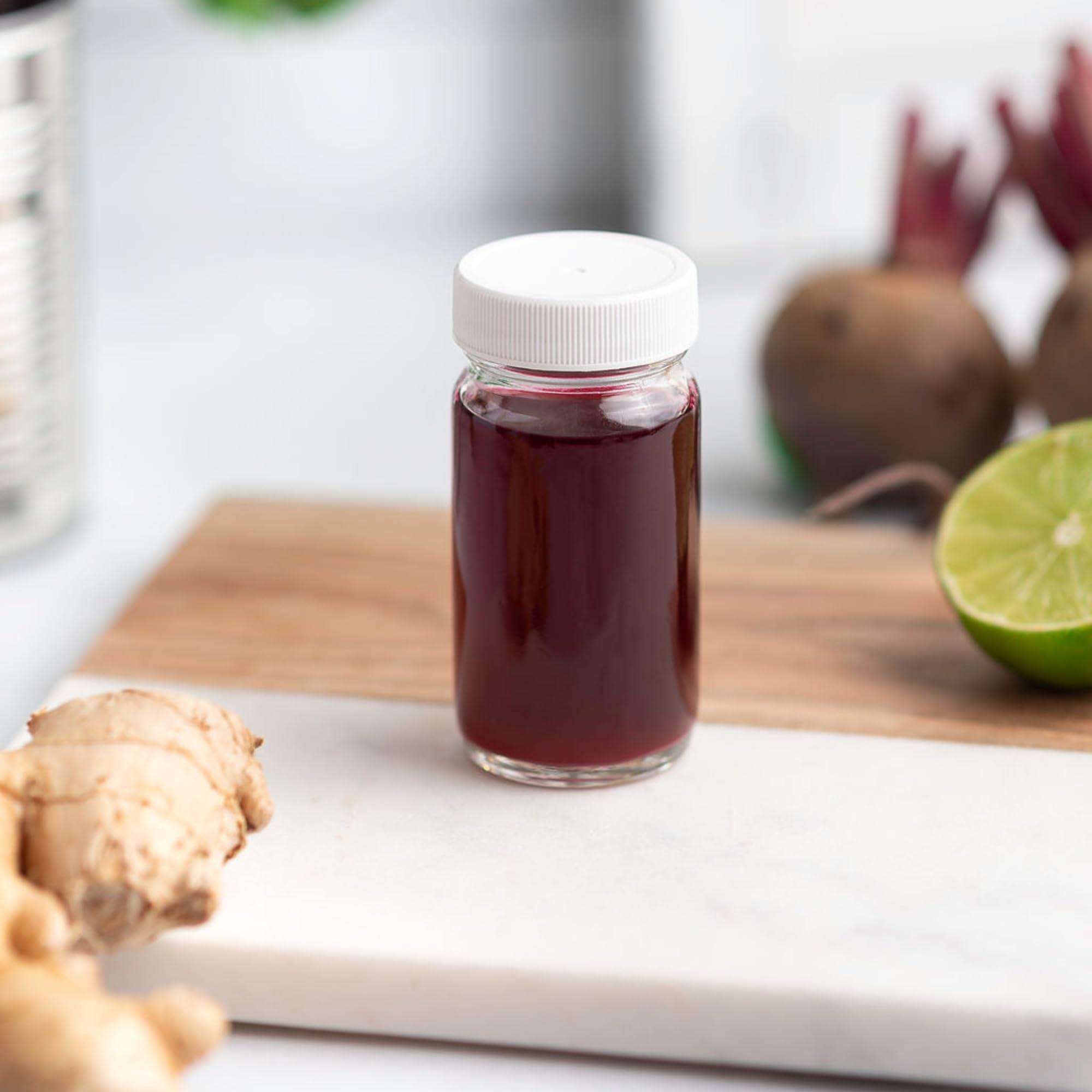 All About Juicing 8-pack juice shot bottles for bulk storage.
