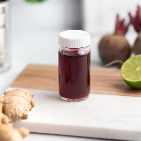 All About Juicing 8-pack juice shot bottles for bulk storage.