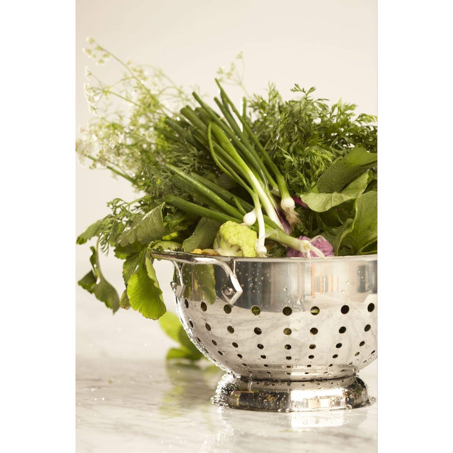 All-Clad colander on pedestal base providing stable support on counter