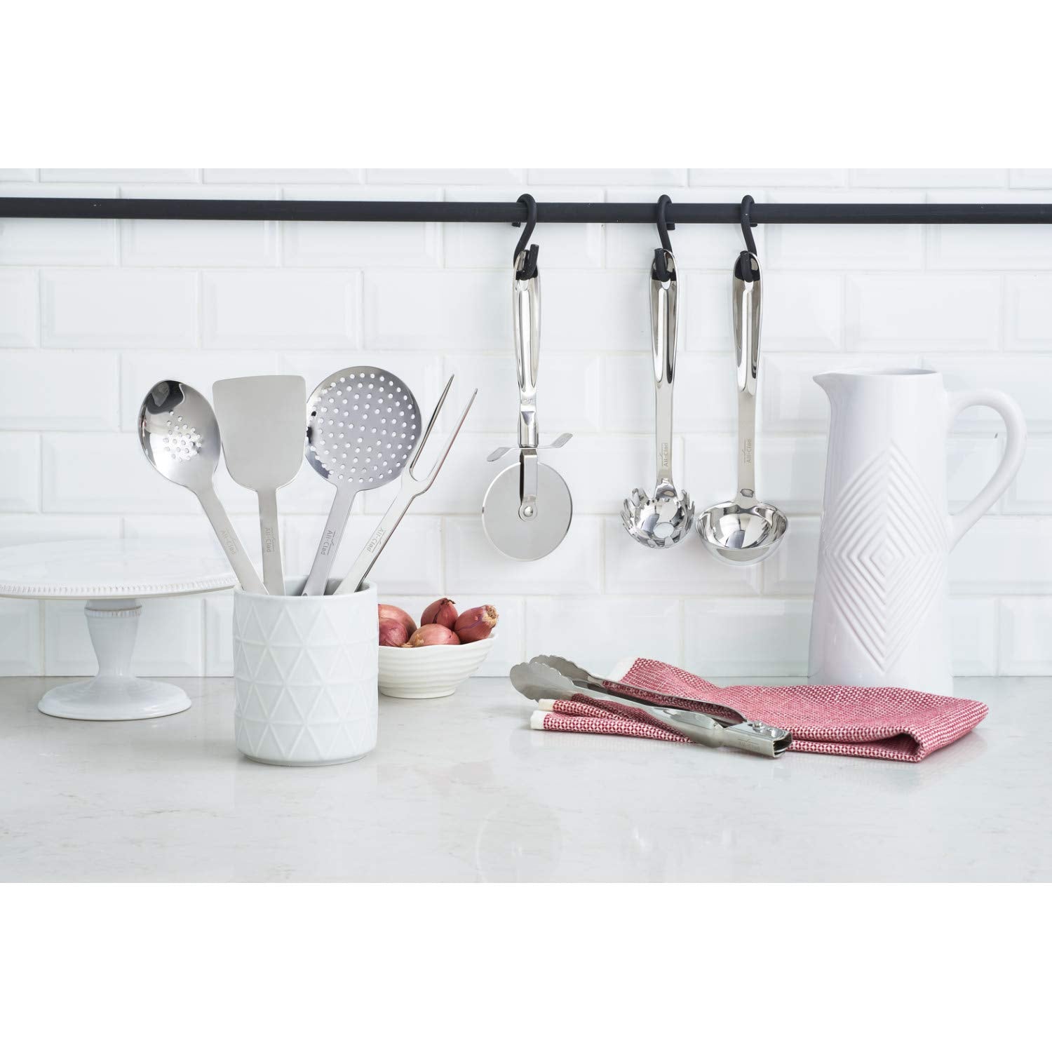 All-Clad locking tongs with ergonomic handle and scalloped head for secure grip; dishwasher-safe.