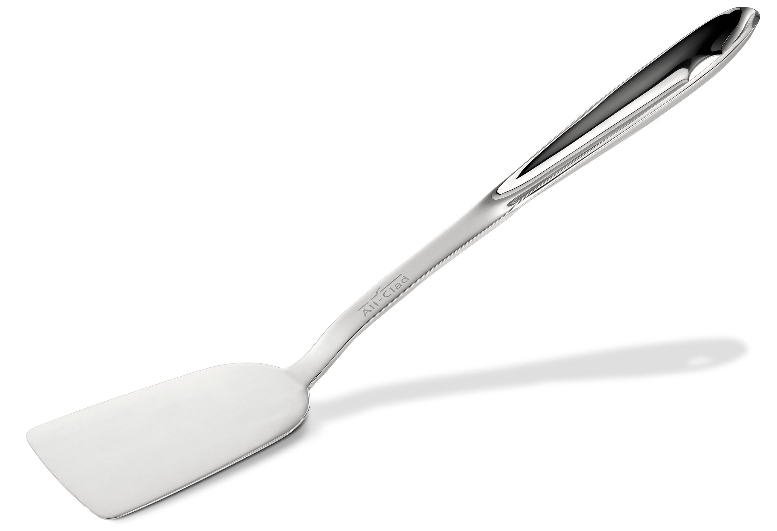 All-Clad 13-inch turner flipping burgers with durable stainless steel for precise control.