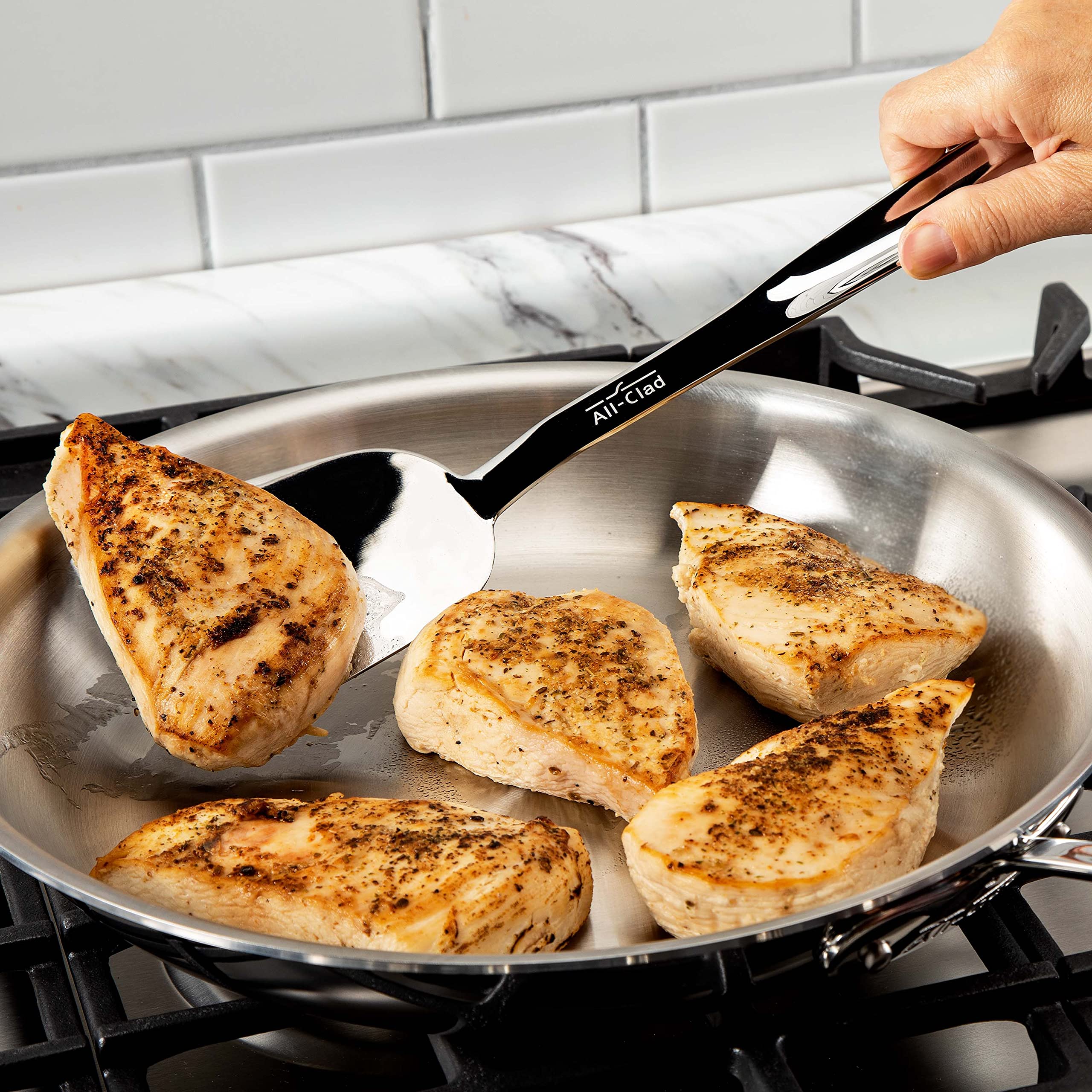 All-Clad 13-inch turner for eggs and stir-frying with a comfortable grooved handle.