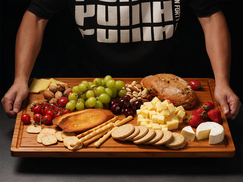 Allsum charcuterie display on a 24x18 bamboo board for party platters.