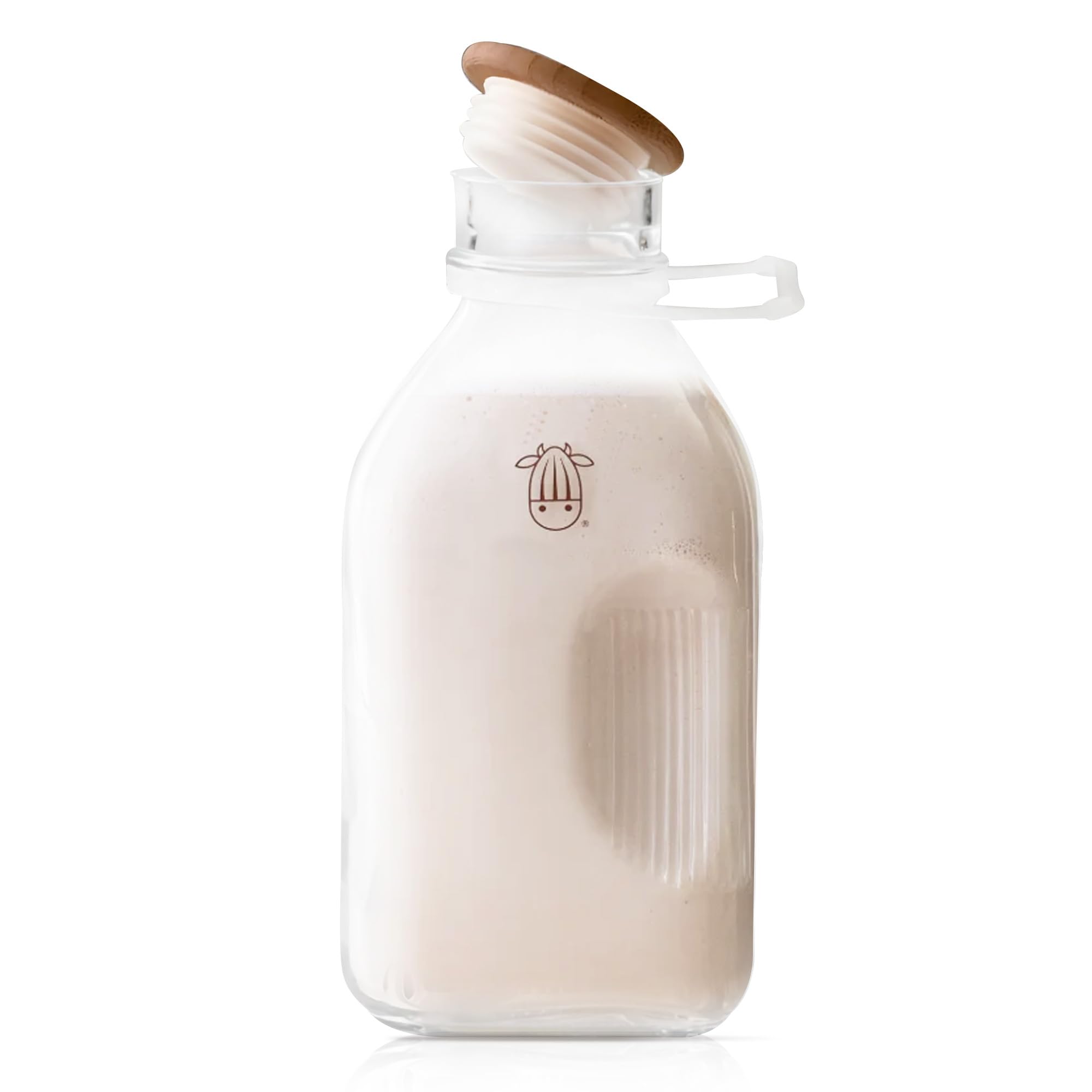 Almond Cow glass pitcher with lid and spout for mess-free pouring.
