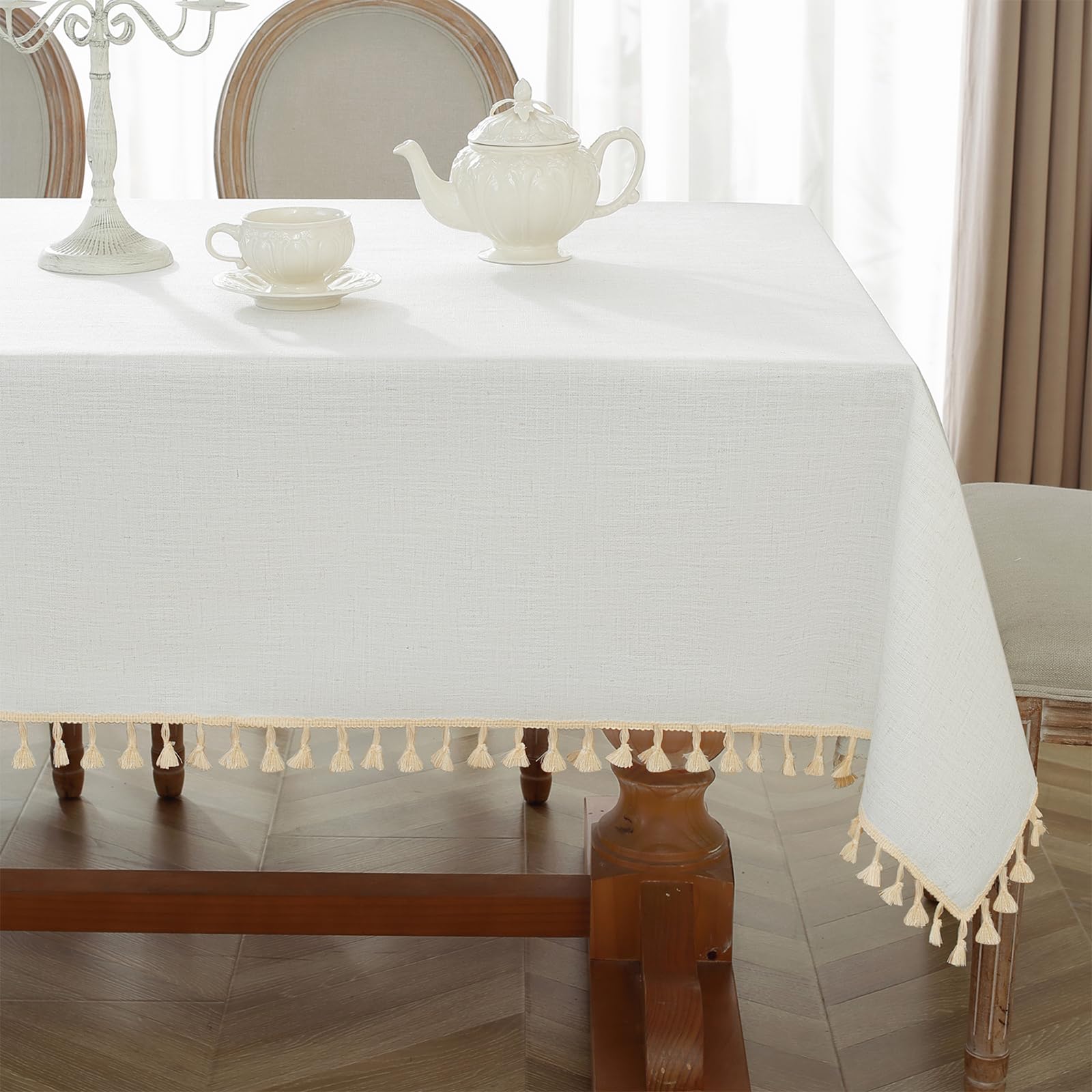Alsoo ivory 55x75 tablecloth draping over dining table for a polished look