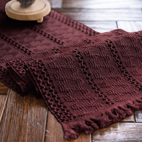 Alynsehom burgundy macrame table runner with tassels enhances dining ambiance.