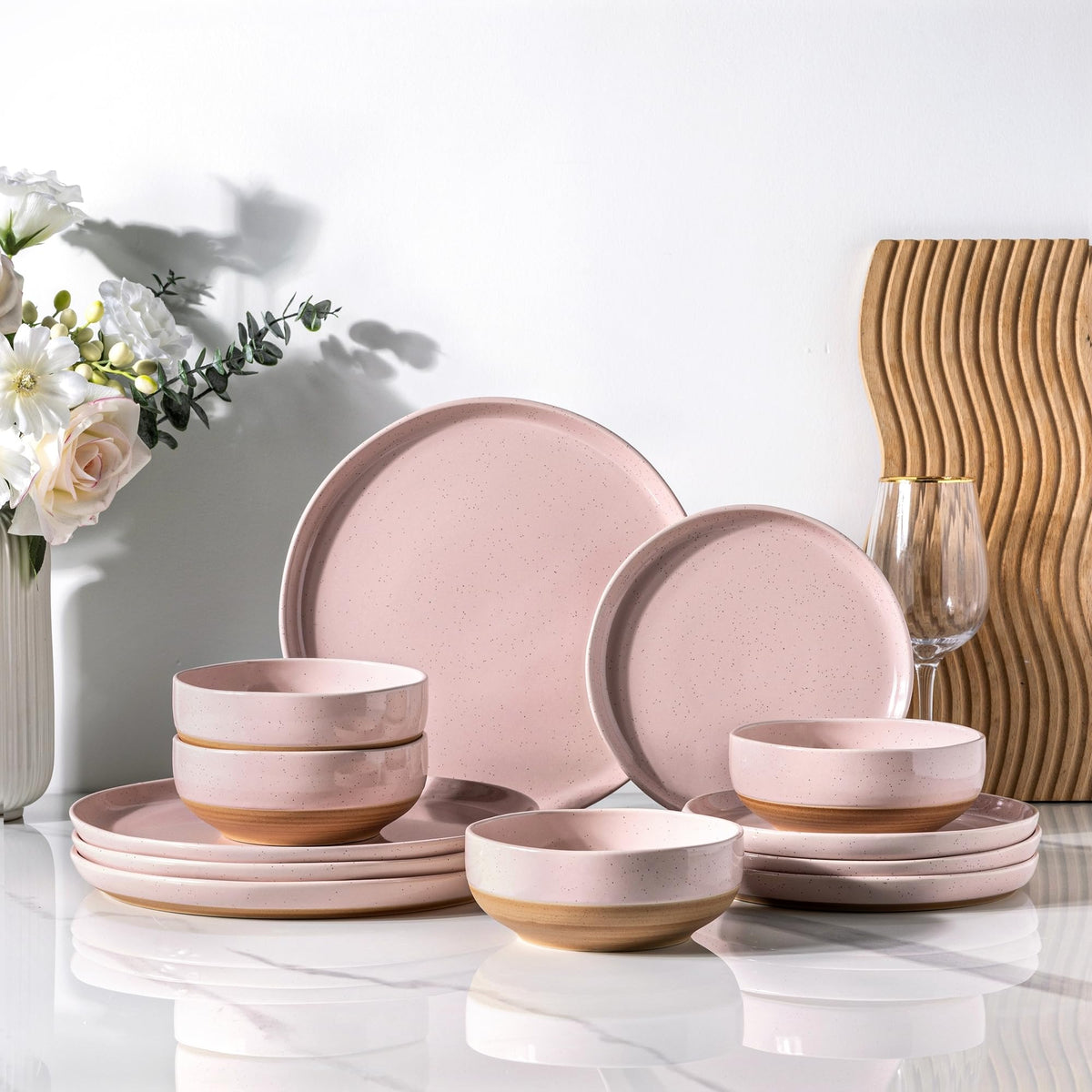AmorArc 12-piece cloud pink dinnerware set for four on a table, ideal for family meals.