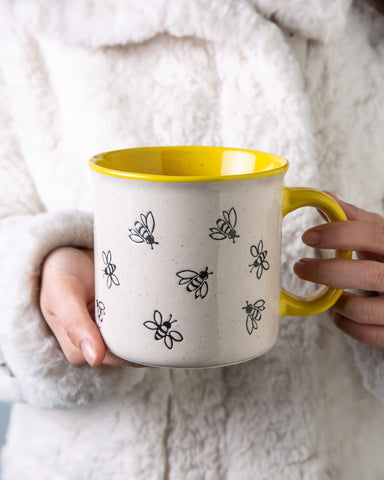Interior glossy glaze of AmorArc mug reflecting light for easy cleaning.