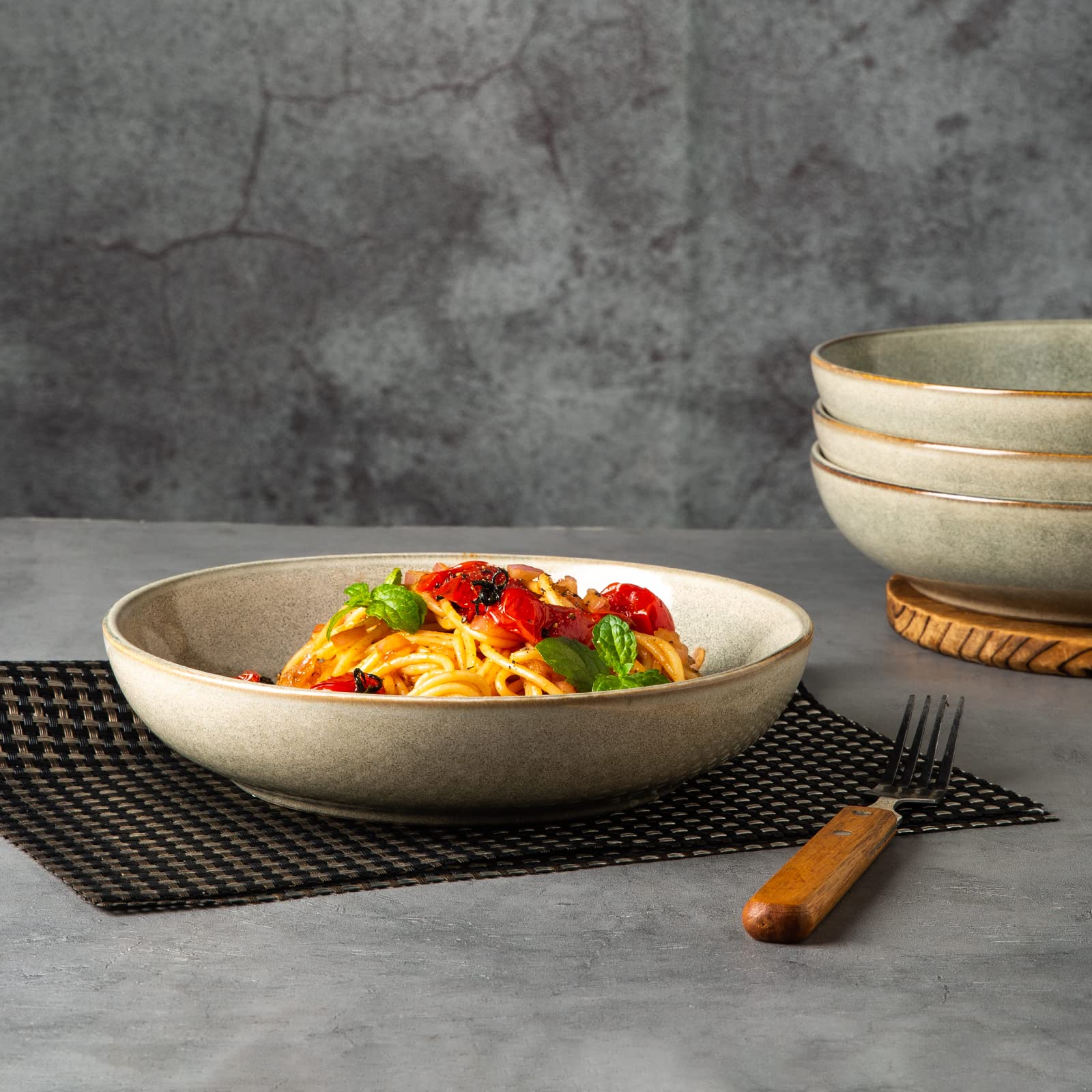 AmorArc stoneware bowl close-up reveals reactive glaze variation.