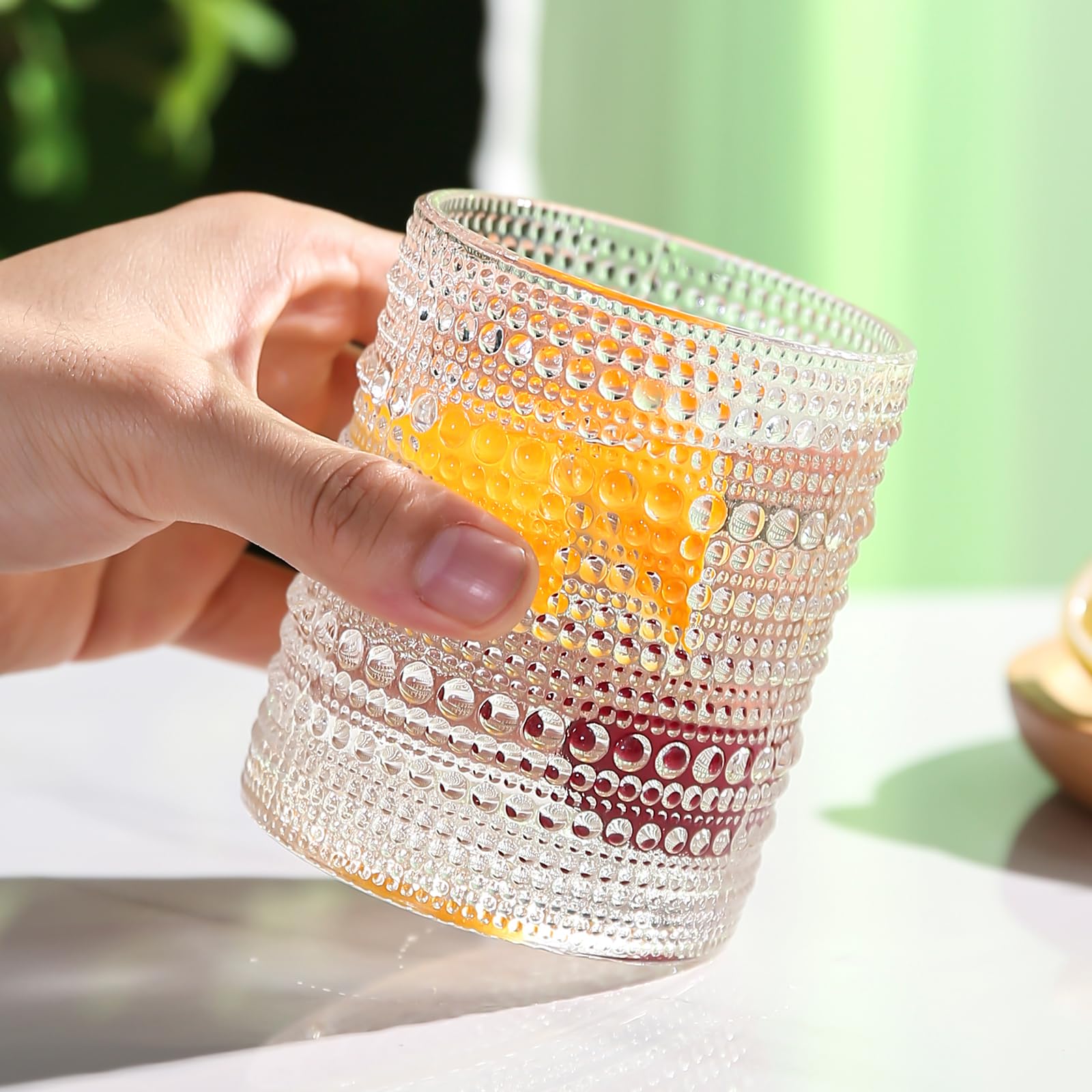 Amyoole glass cups on a dining table demonstrating comfortable grip.