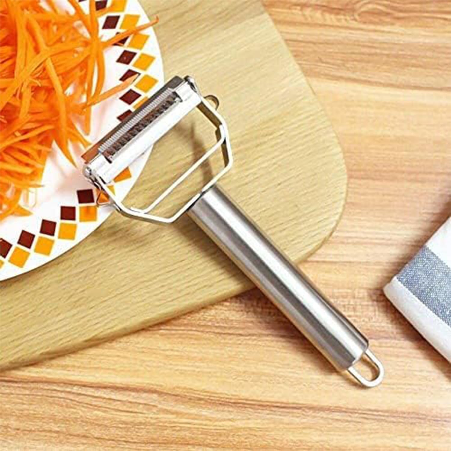 AnGeer Julienne Peeler eye-removal feature eases blemish scraping on potatoes and carrots.