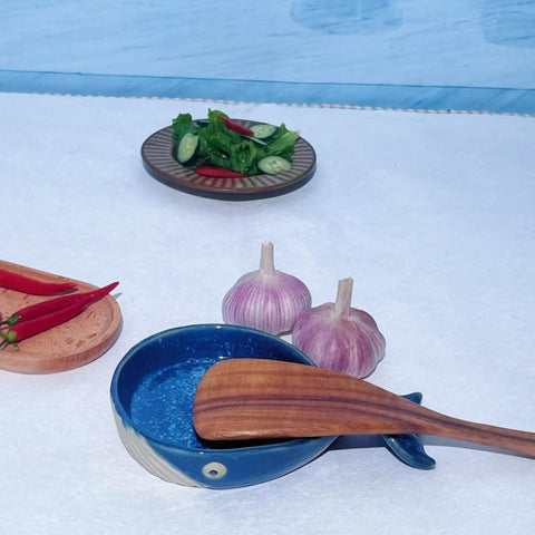 ANLYAWX multi-use kitchen stand shown as spoon rest and small display piece.