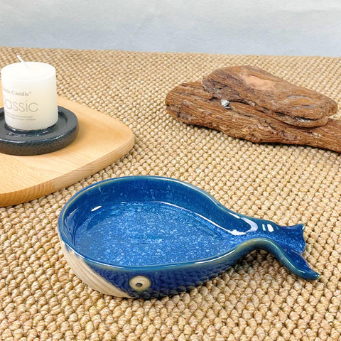 ANLYAWX whale kitchen accessory used as a decorative spoon rest beside cooking tools.