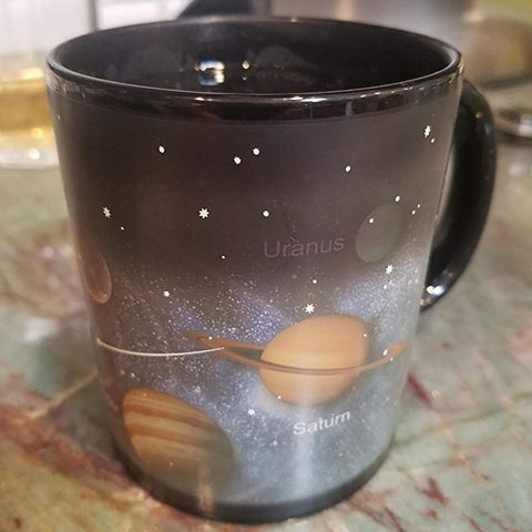 Antspirit porcelain mug reveals celestial imagery when heated, enhancing morning rituals.