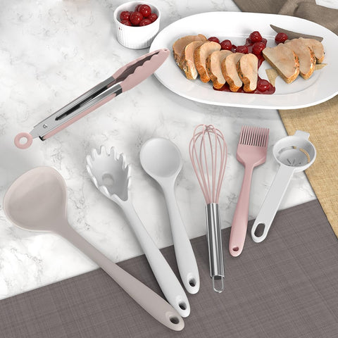 AOTHOD silicone slotted spoon draining broth from pot while serving soup.
