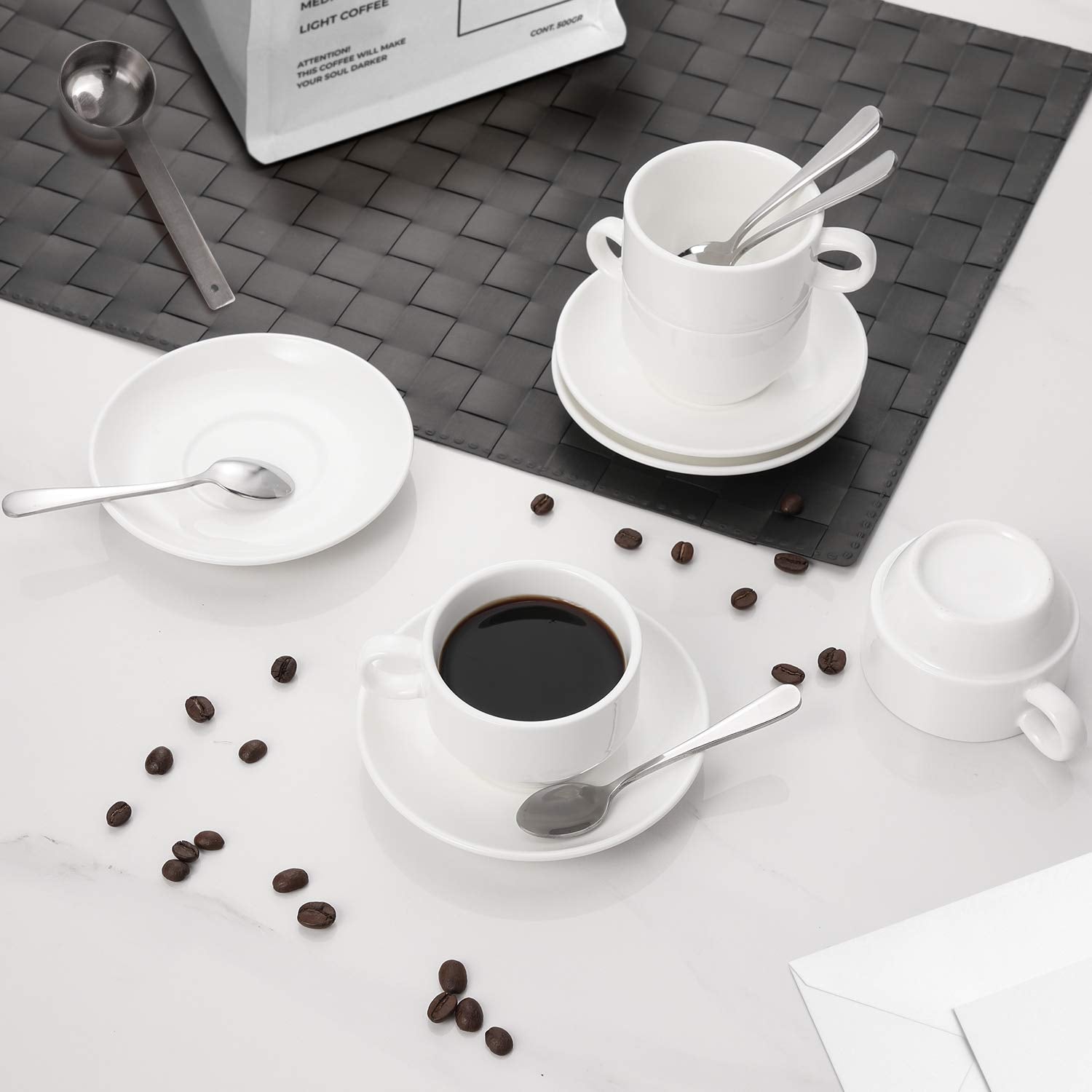 AOZITA white saucers for elegant espresso service on a clean surface.