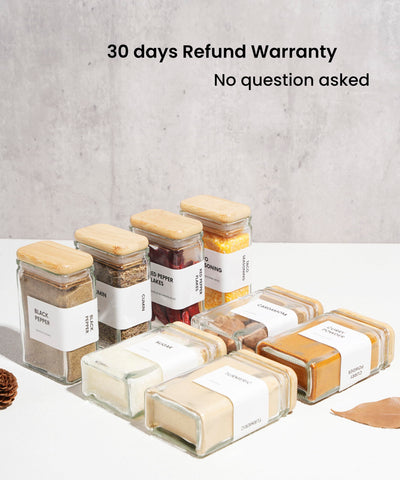 Clear glass showcases spices and herbs with natural bamboo lids.