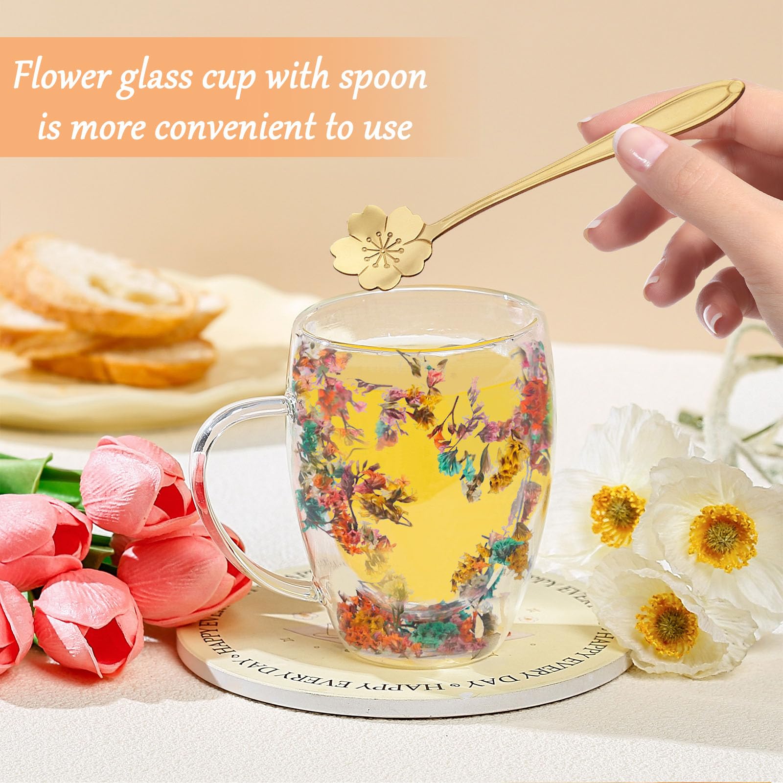 Arefen glass tea cup features dried flowers and a sturdy handle for easy sipping.
