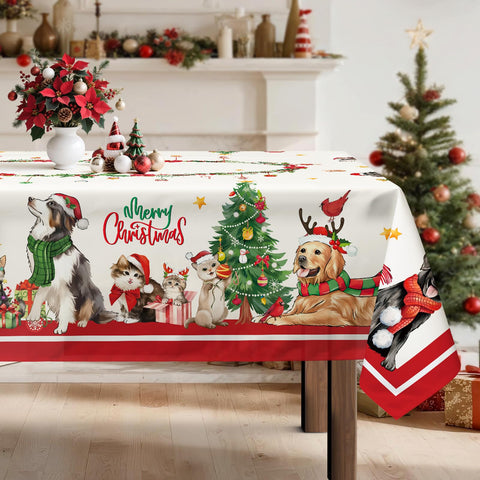 Arquiel Christmas Cats Dogs Tablecloth in red on a dining table, festive scene