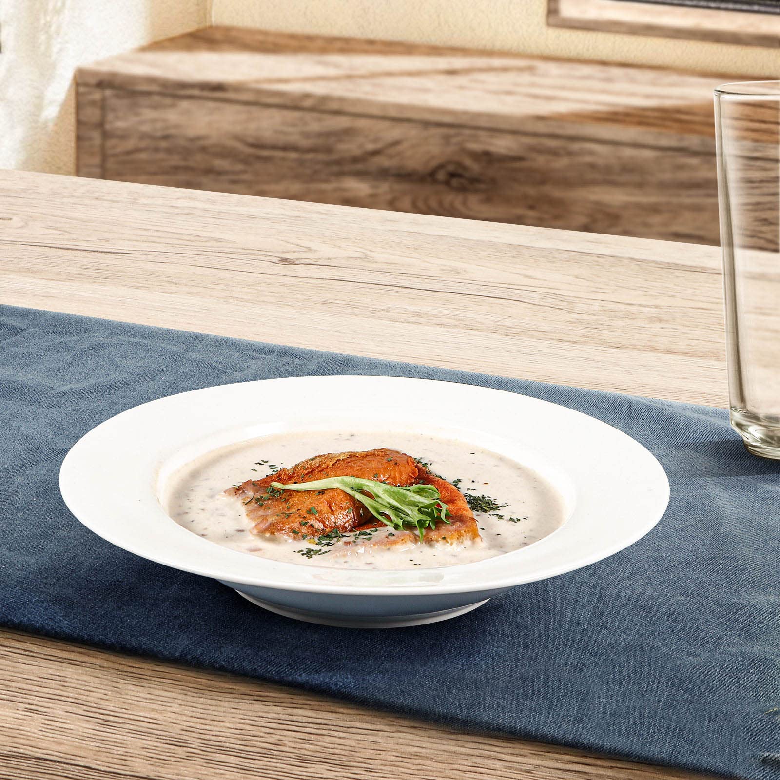 Artena elegant dinner table setup with white porcelain bowls.